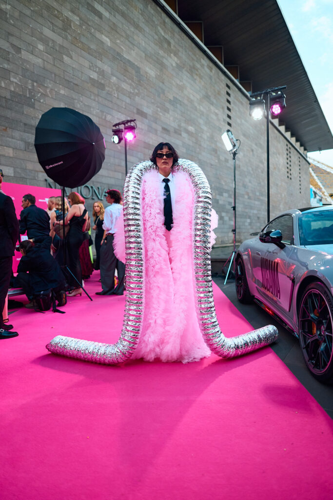 Charlene Ye Davis, Wearing a pink flamingo style jacket over the top of a White Business shirt and Prada Gabardine Tie, National Gallery of Victoria’s NGV GALA 2024. Chromatic Times Melbourne Fashion Photographer - Aidan McCorry